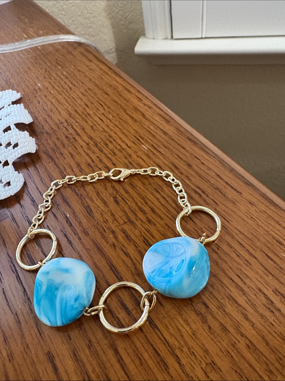 Gold Link Bracelet with Blue Swirl Beads